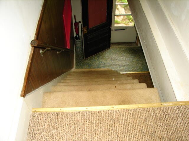 staircase featuring tile flooring