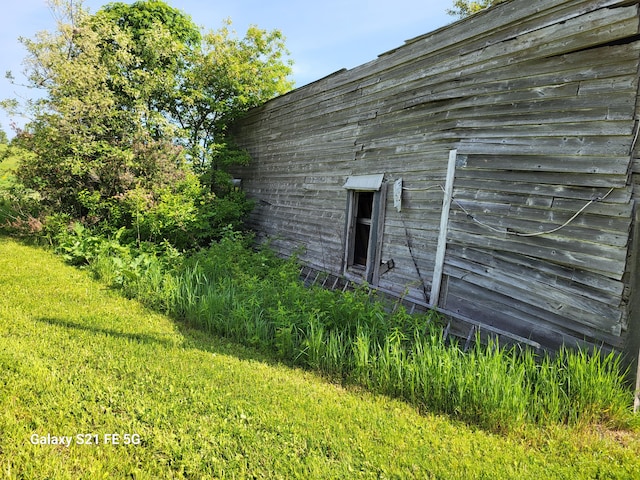 view of home's exterior featuring a yard