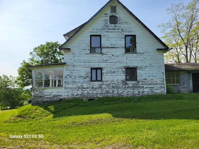 view of home's exterior featuring a yard