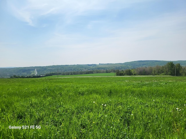 property view of mountains featuring a rural view