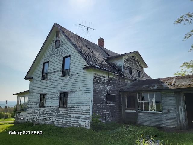 view of home's exterior with a yard