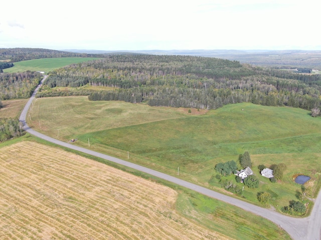 birds eye view of property with a rural view