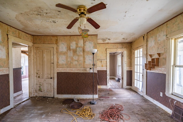 miscellaneous room featuring ceiling fan and dark hardwood / wood-style floors