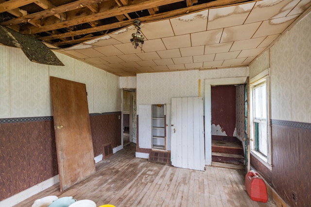 unfurnished bedroom featuring hardwood / wood-style flooring