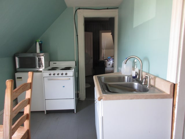 kitchen with lofted ceiling, white electric range oven, sink, and white cabinetry