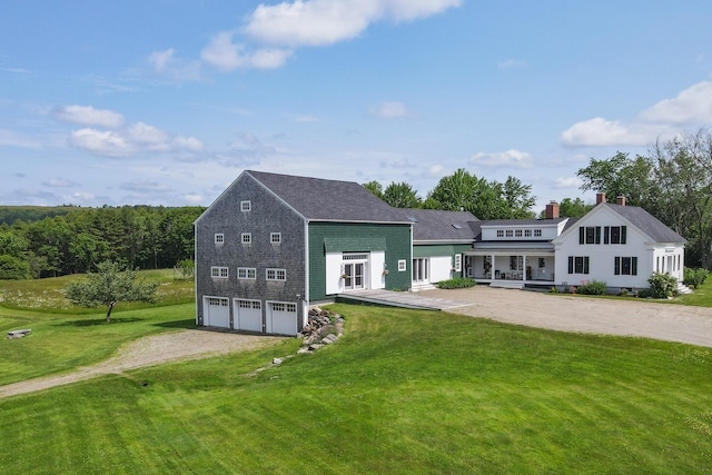 view of front of house with a front yard and a garage