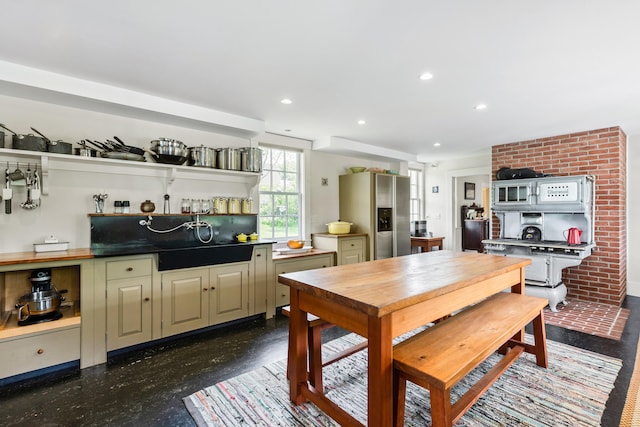 dining space featuring brick wall