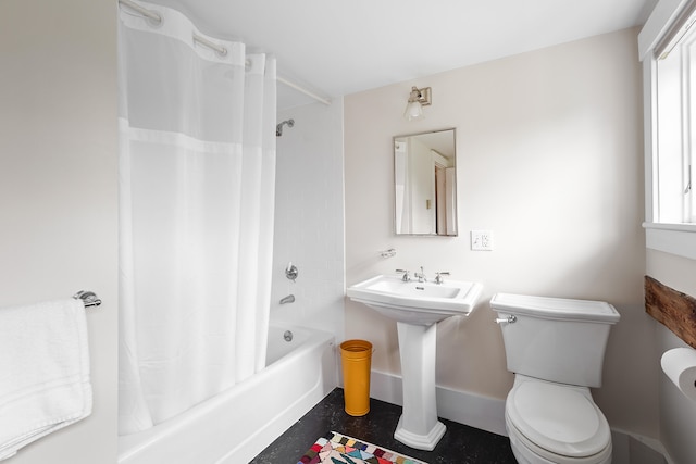 bathroom with shower / tub combo, toilet, and a wealth of natural light