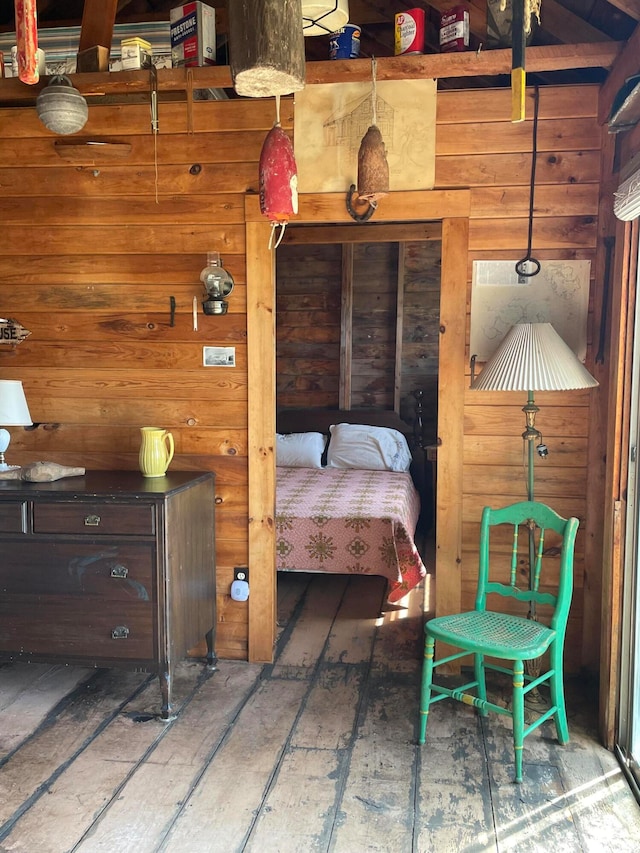 bedroom with wood walls