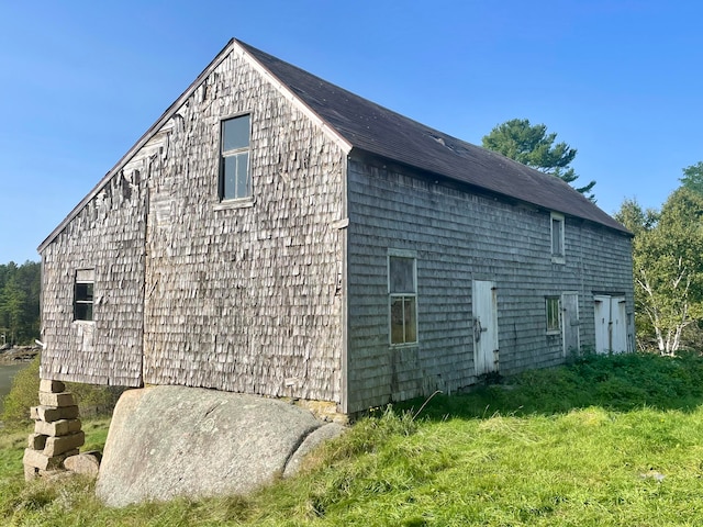 view of property exterior featuring a yard