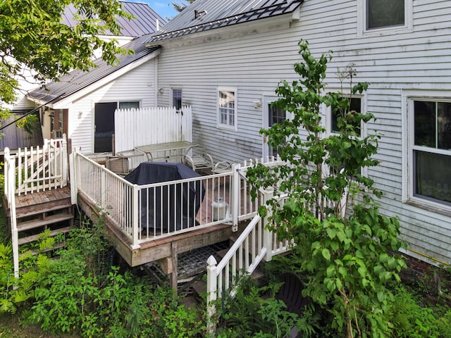 back of house featuring a deck