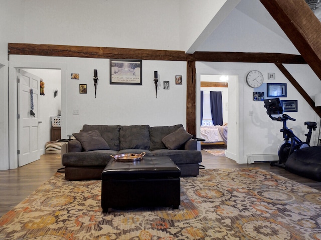 living room with hardwood / wood-style flooring and beam ceiling