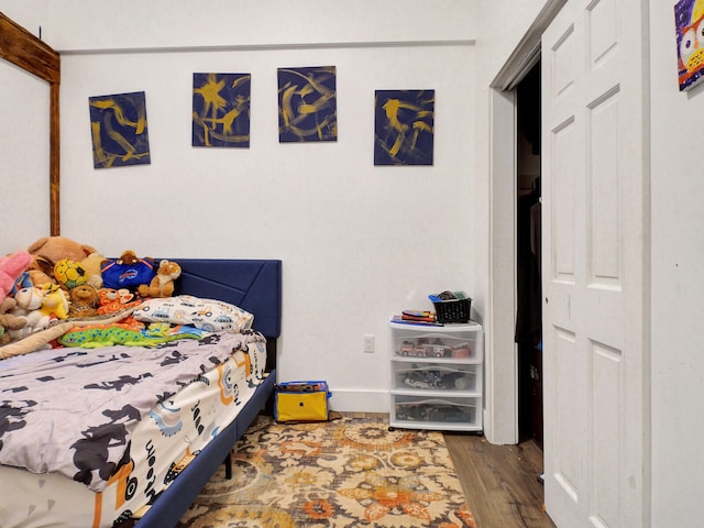 bedroom with hardwood / wood-style floors