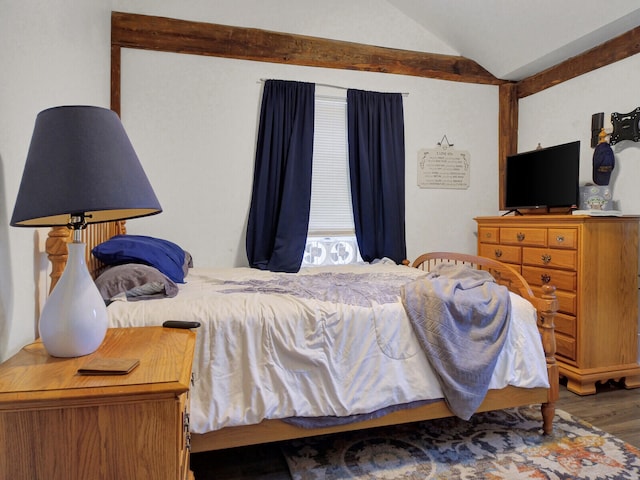 bedroom with wood-type flooring and vaulted ceiling