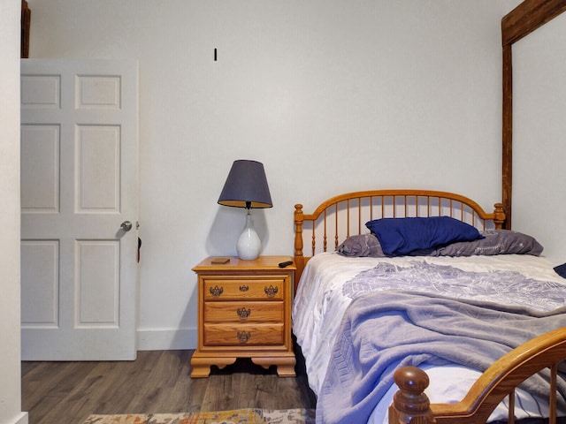 bedroom featuring dark hardwood / wood-style floors