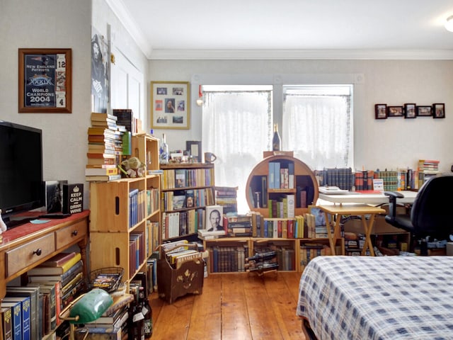 bedroom featuring wood-type flooring and crown molding