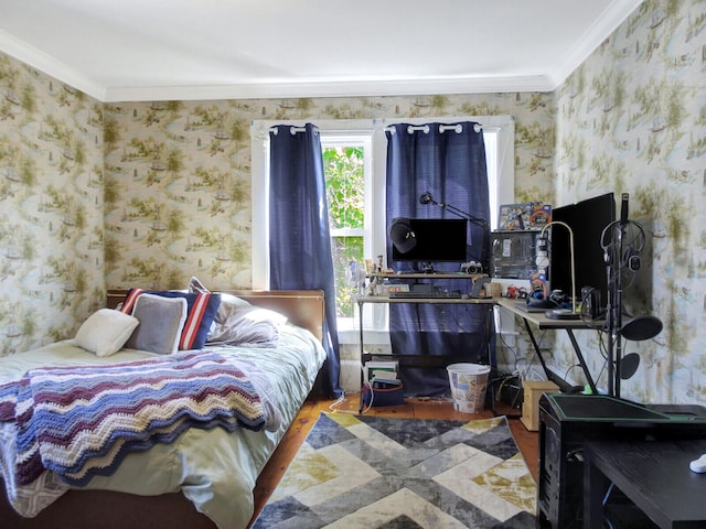 bedroom featuring hardwood / wood-style floors and crown molding