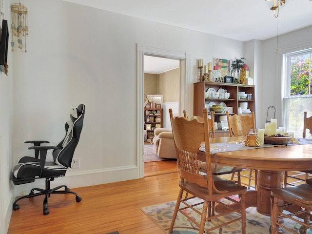 dining space featuring light wood-type flooring