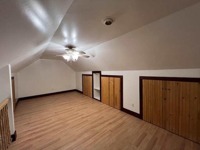 bonus room with ceiling fan, light wood-type flooring, and vaulted ceiling