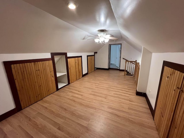 additional living space featuring lofted ceiling, ceiling fan, and light hardwood / wood-style floors