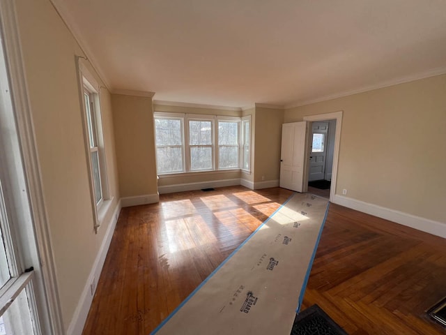 spare room featuring crown molding