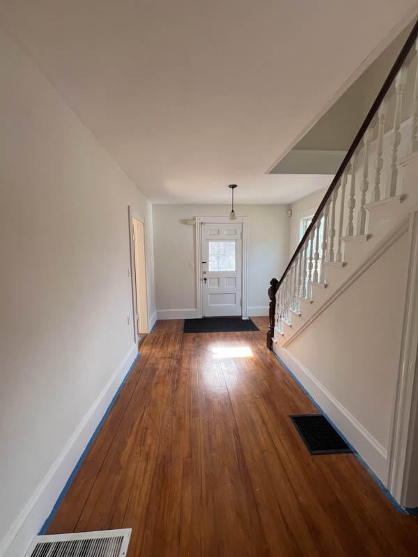 foyer featuring wood-type flooring