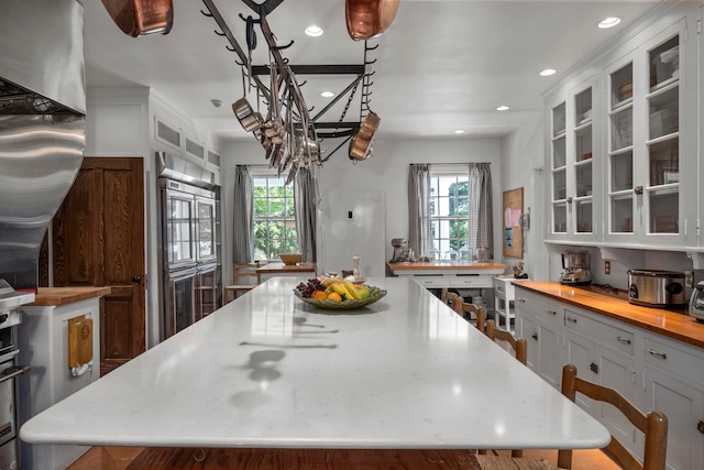 kitchen with white cabinetry and a center island