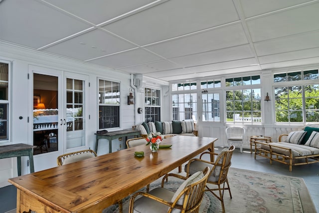 sunroom / solarium featuring french doors