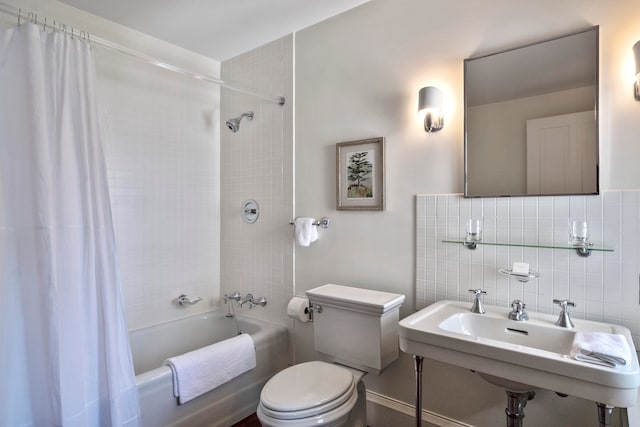 full bathroom with shower / bath combination with curtain, tile walls, backsplash, sink, and toilet