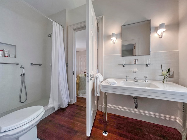 bathroom with hardwood / wood-style floors, backsplash, toilet, and tile walls