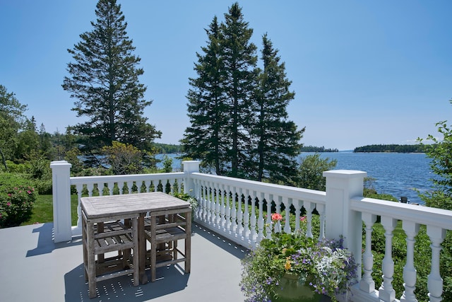 view of terrace with a water view