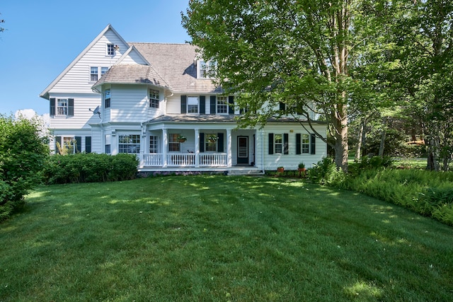 view of front facade with a front lawn and a porch