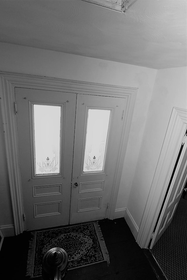 entryway with french doors and a wealth of natural light