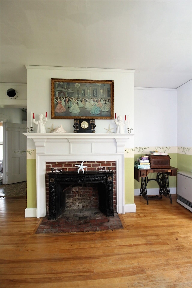 living room featuring a fireplace and hardwood / wood-style flooring