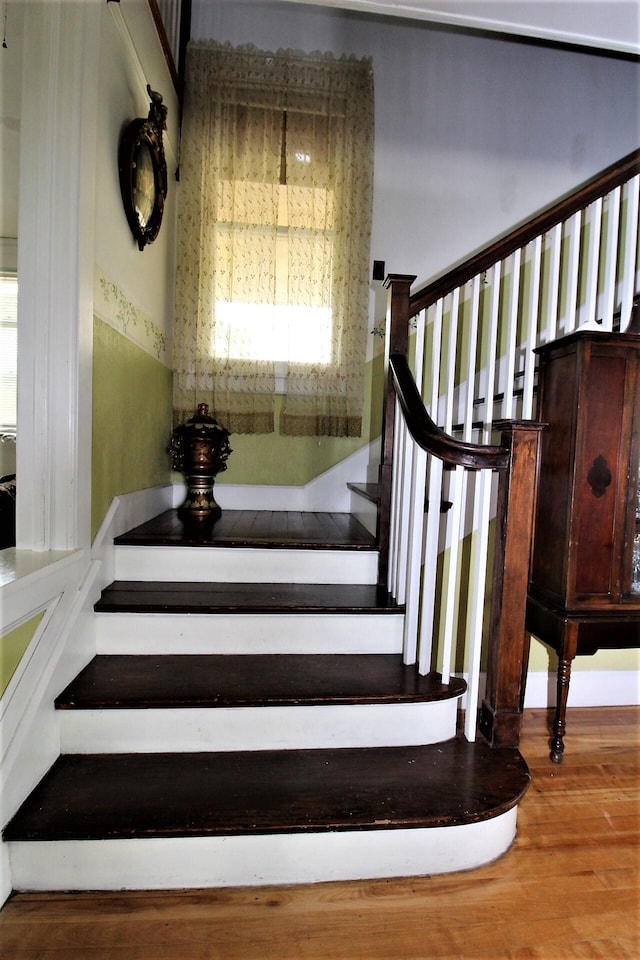 staircase featuring hardwood / wood-style flooring