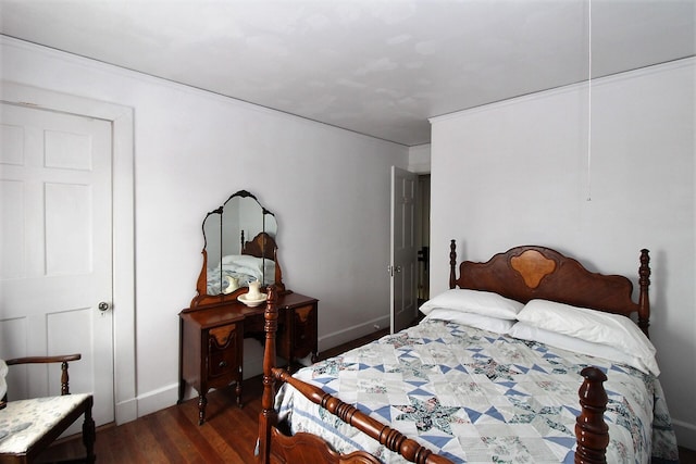 bedroom with dark wood-type flooring