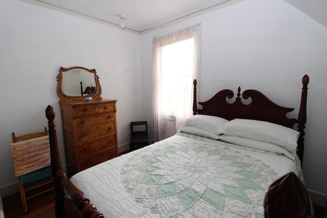 bedroom with dark hardwood / wood-style flooring