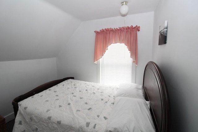 bedroom with vaulted ceiling