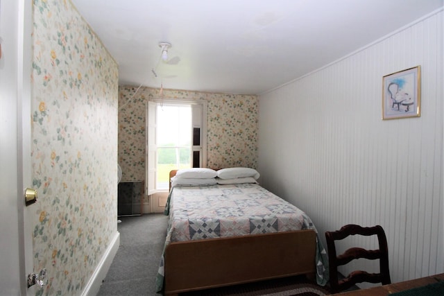 bedroom featuring dark colored carpet