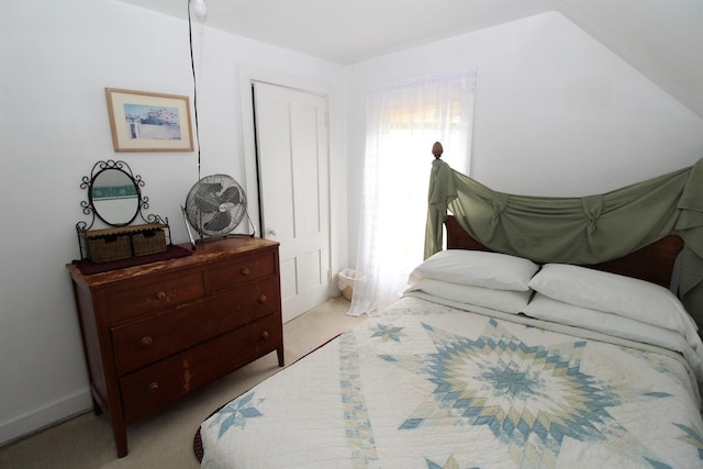 bedroom with light colored carpet