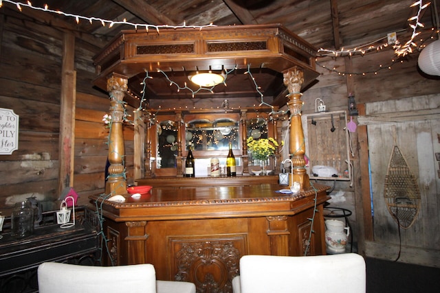 bar featuring wooden walls and wooden ceiling