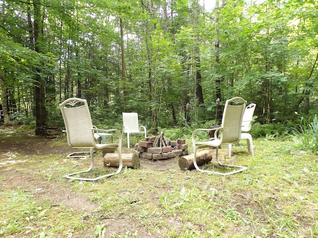 view of yard with a fire pit