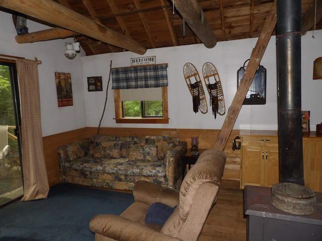 living room featuring wooden ceiling, a wood stove, lofted ceiling with beams, and dark hardwood / wood-style flooring