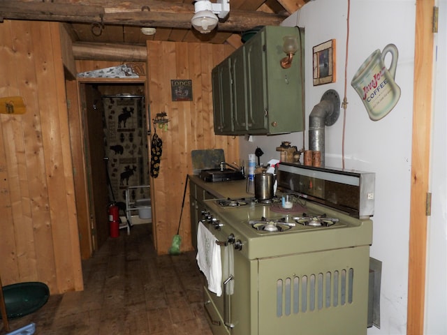 kitchen featuring wood walls, stove, beamed ceiling, dark wood-type flooring, and green cabinetry