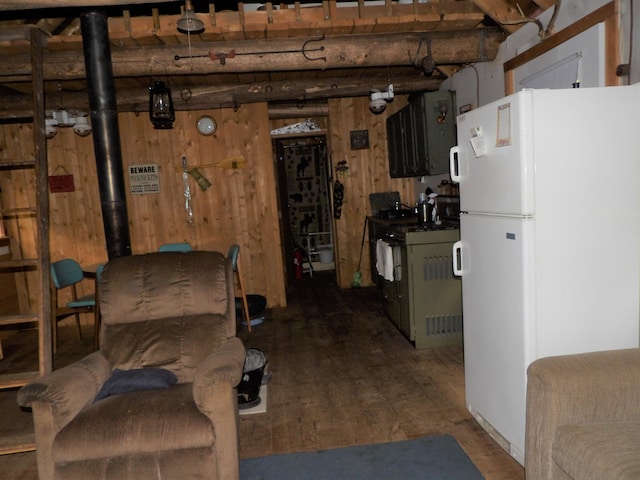 basement featuring white fridge