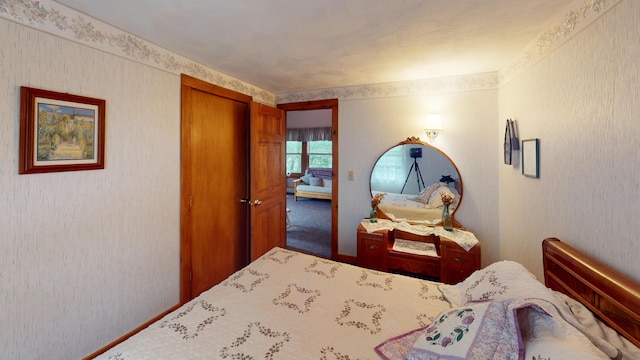 bedroom featuring carpet and a closet