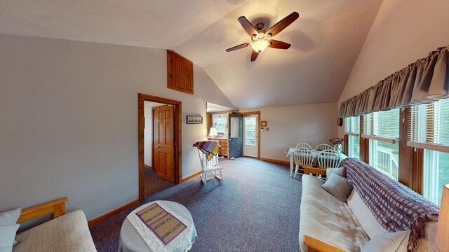 living room featuring lofted ceiling, ceiling fan, and carpet floors