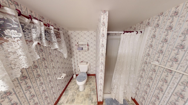 bathroom featuring toilet, wallpapered walls, tile patterned floors, and a shower with shower curtain