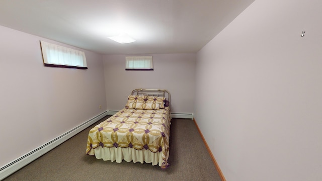 bedroom featuring dark carpet and a baseboard radiator