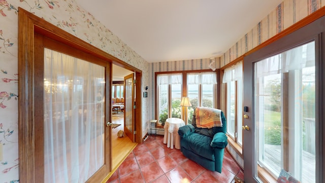 sunroom with a baseboard radiator